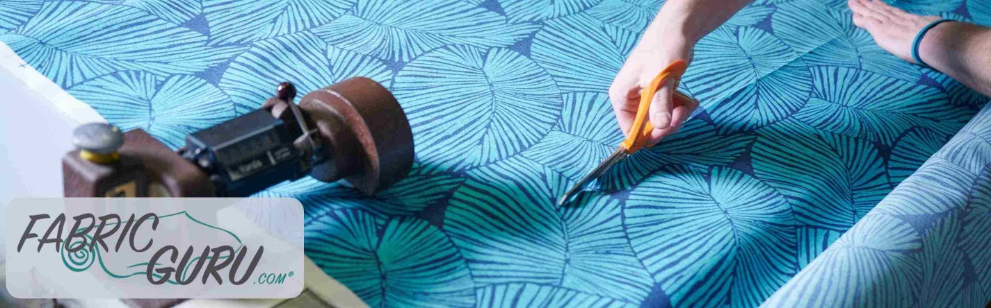FabricGuru.com: Displays fabric being cut