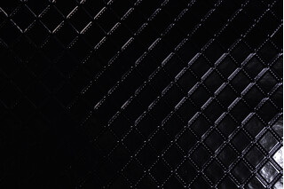 Scalamandre Mademoiselle&#39;s Quilt Embossed Vinyl Upholstery Fabric in Noir