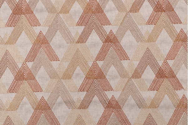 Arrowhead Embroidered Drapery Fabric in Spice