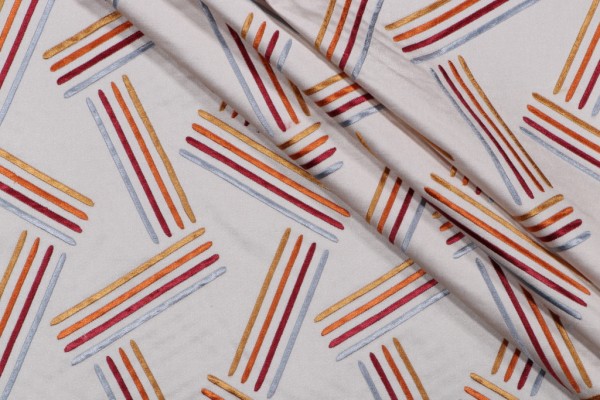 Cayson Embroidered Decorator Fabric in Sunset 