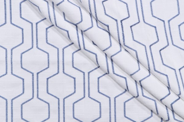 Takeoff Embroidered Drapery Fabric in Ocean
