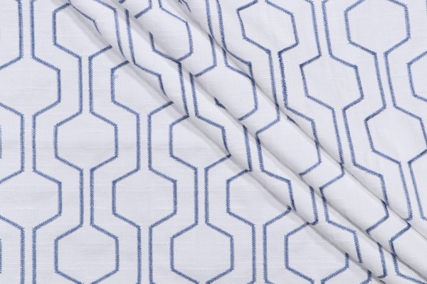 Takeoff Embroidered Drapery Fabric in Ocean