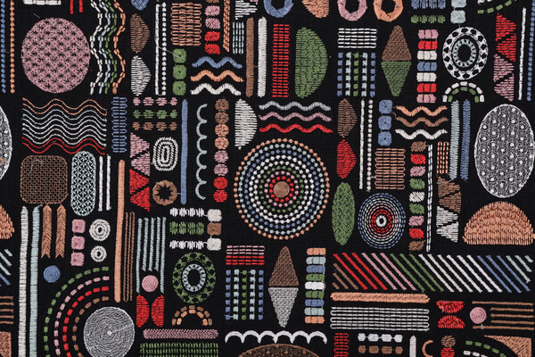 Covington Hieroglyphics Embroidered Drapery Fabric in 150-Mardi Gras